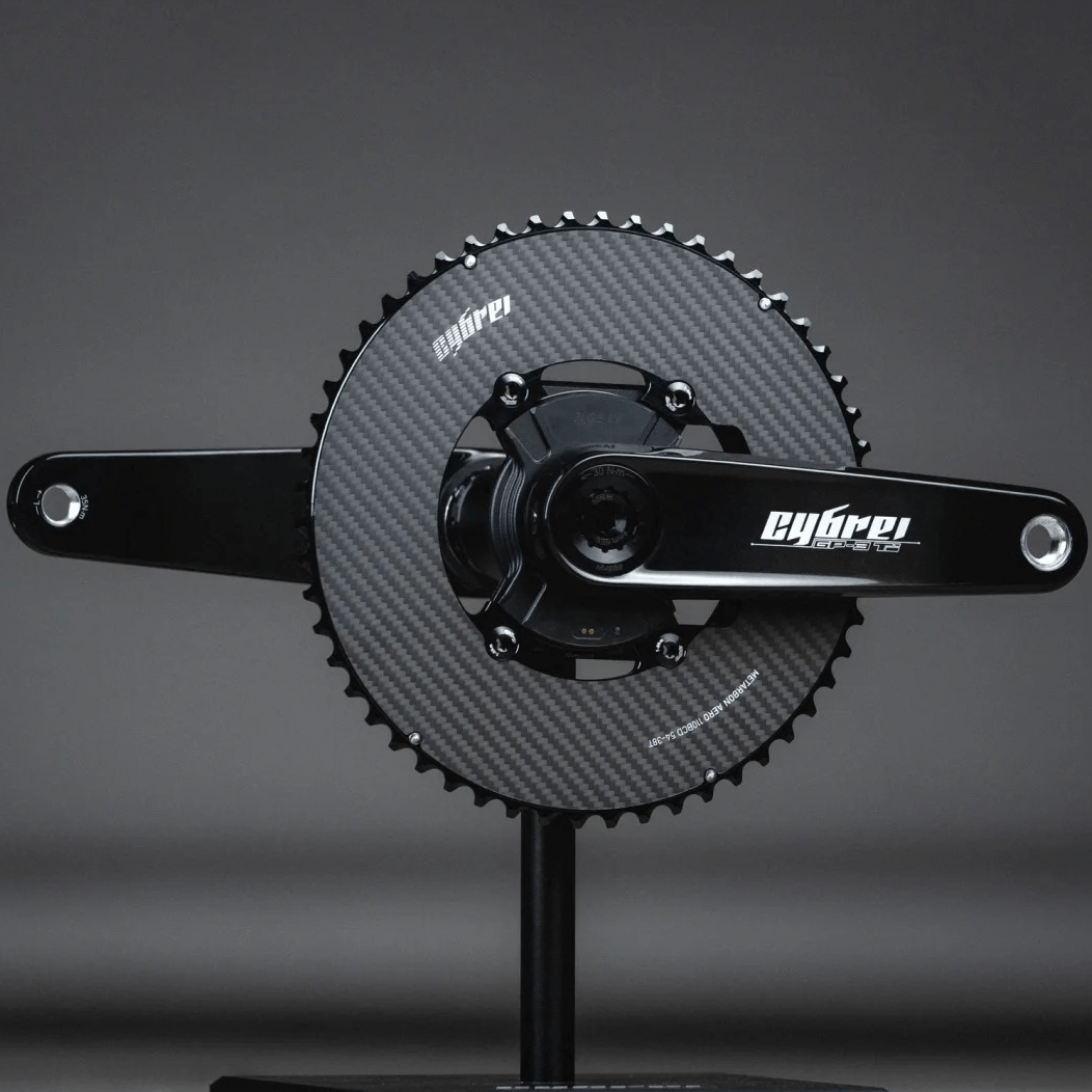 Carbon crankset mounted on a modern aero road bike with aero 2x chainrings