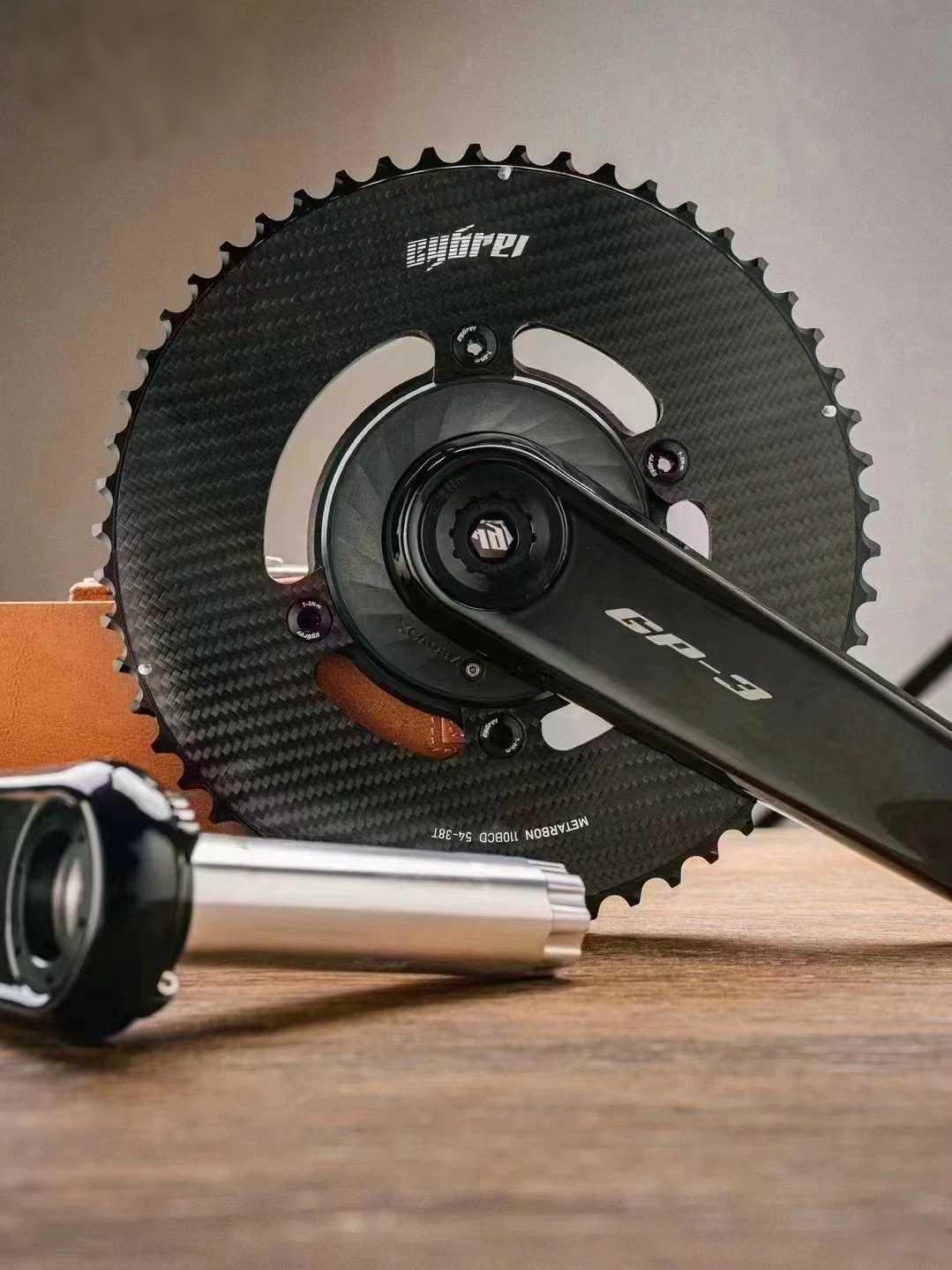 24 axle carbon crankset close-up showing T1000 carbon arms and chainrings